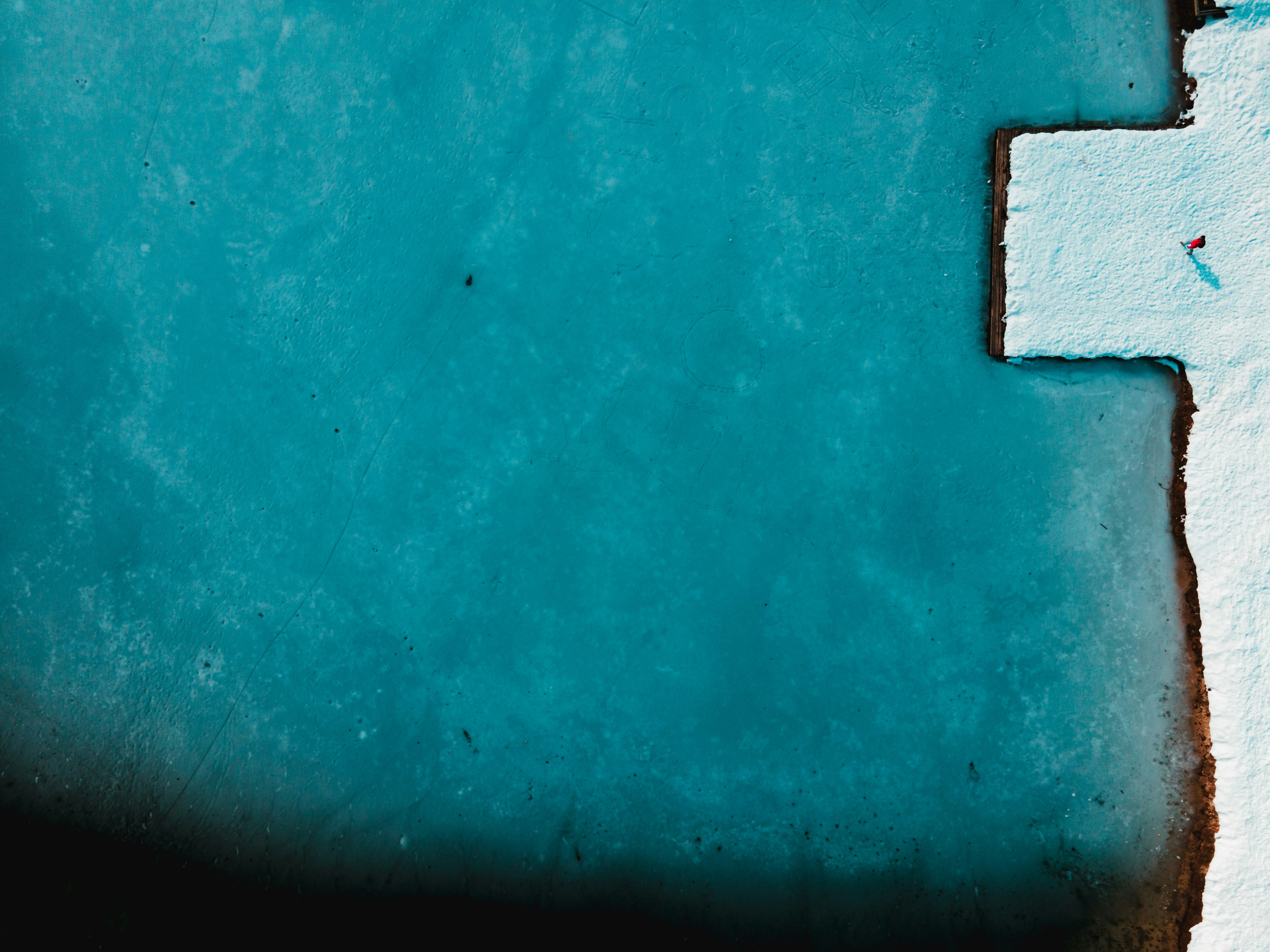 brown square brick on blue surface